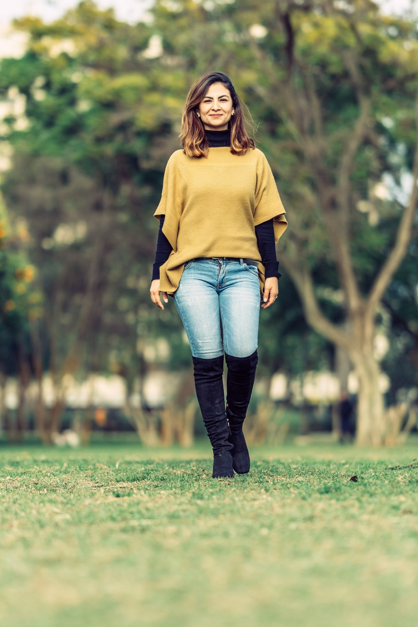 latina woman walks smiling looking at the camera
